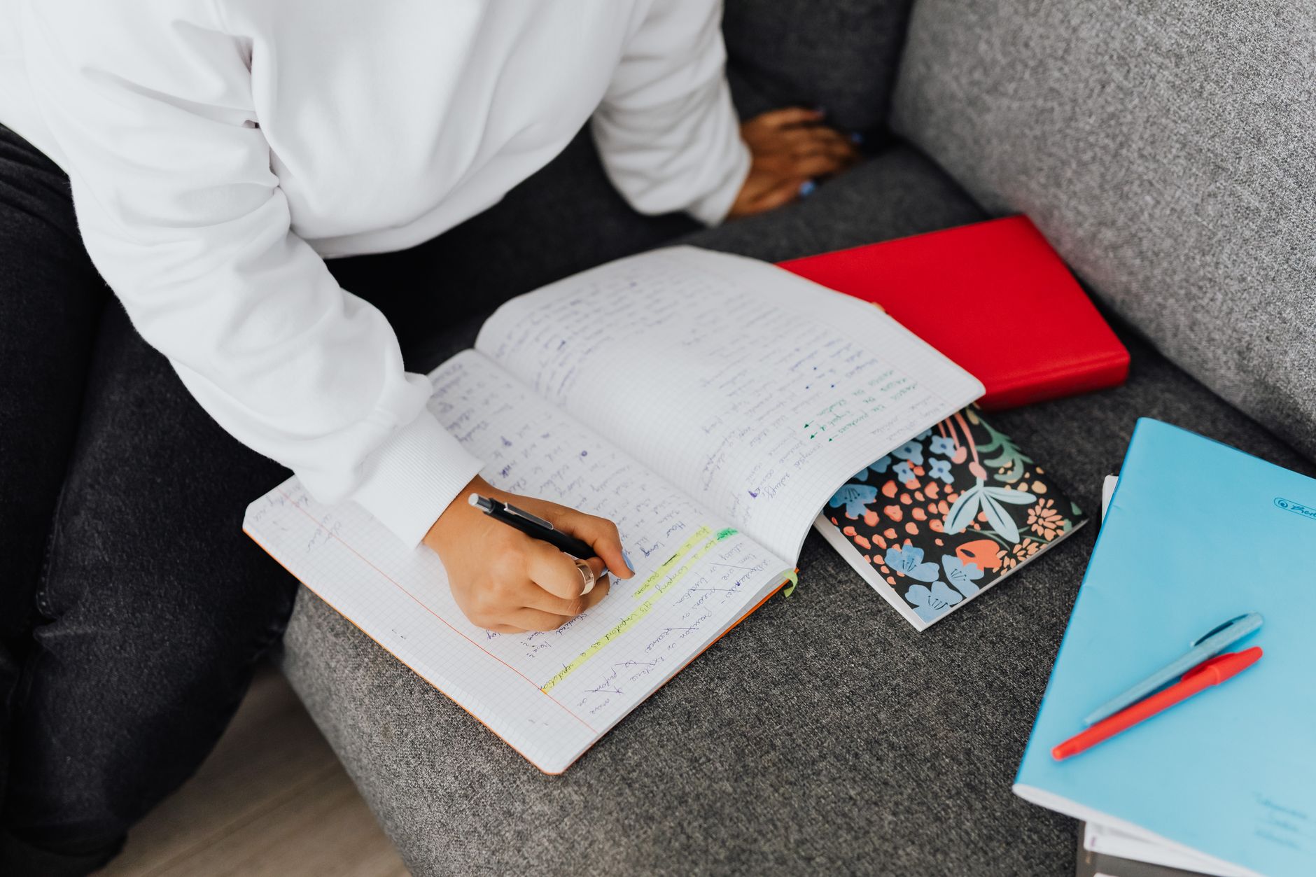 Student organizing study materials and notes for exam preparation