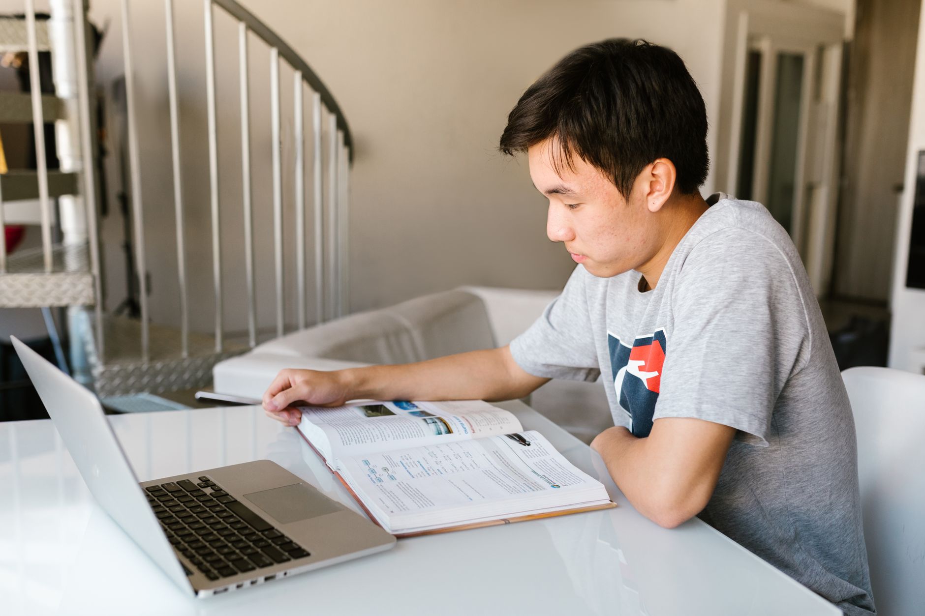 Student studying on a laptop preparing for the Digital SAT