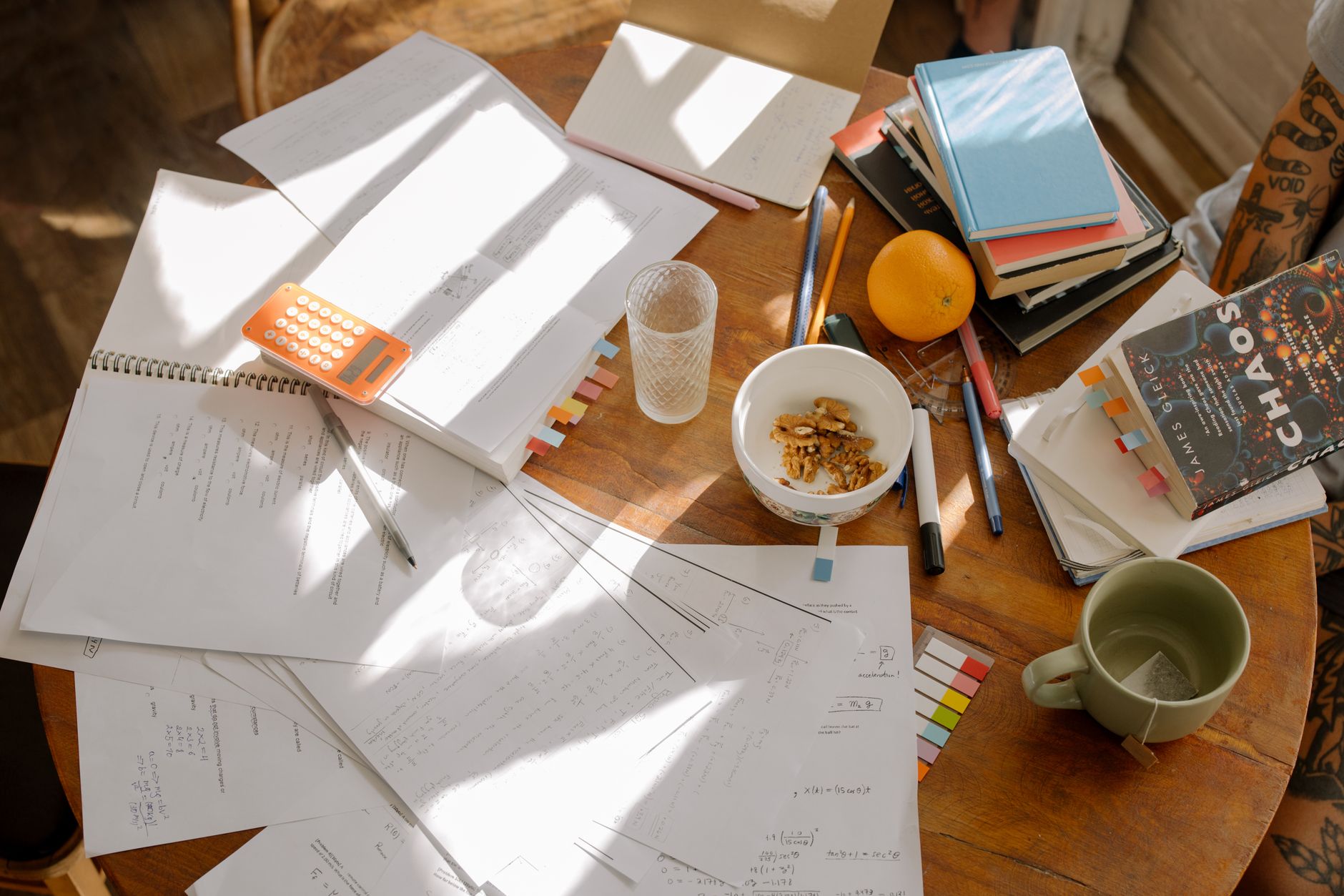 Student mapping out a study schedule and prep timeline at a desk