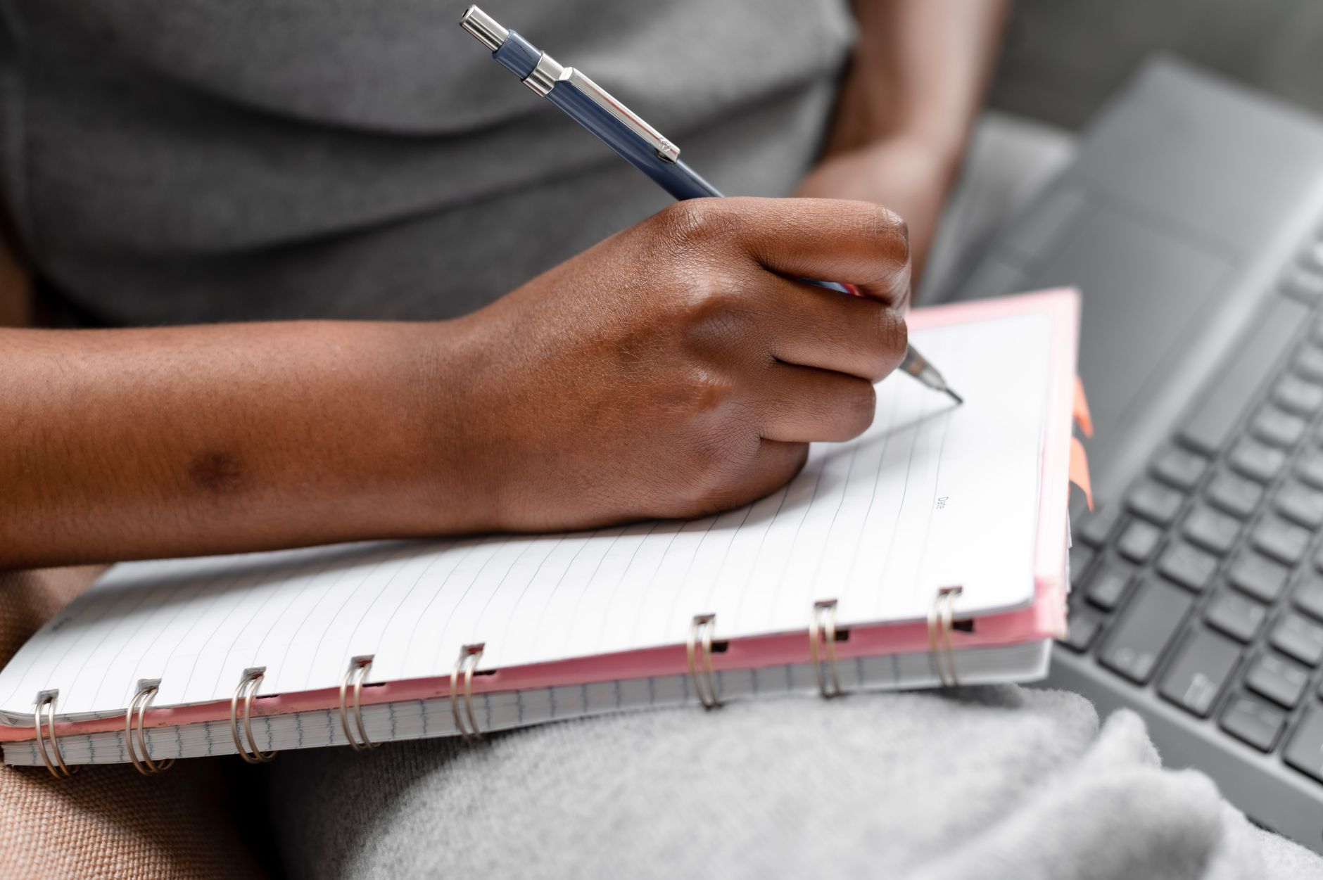 Student writing grammar notes while studying