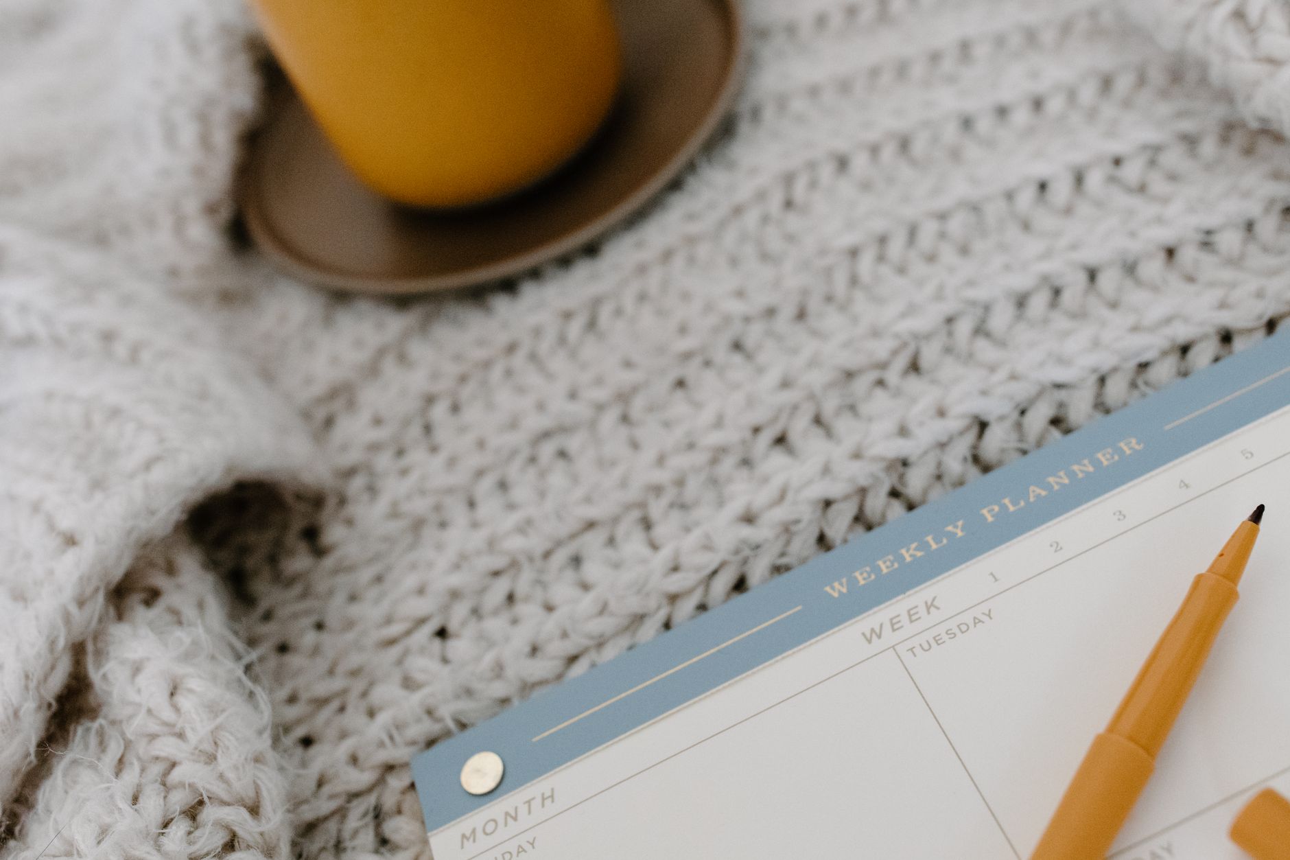 Student organizing a week-by-week study schedule at a desk