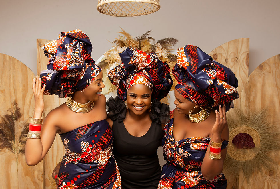 Women wearing traditional Mozambican attire and colorful headwraps, showcasing the rich culture and heritage of Mozambique.