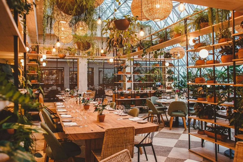 tables, chairs, glasses and plants at Terraço Jardins restaurant, Sao Paulo