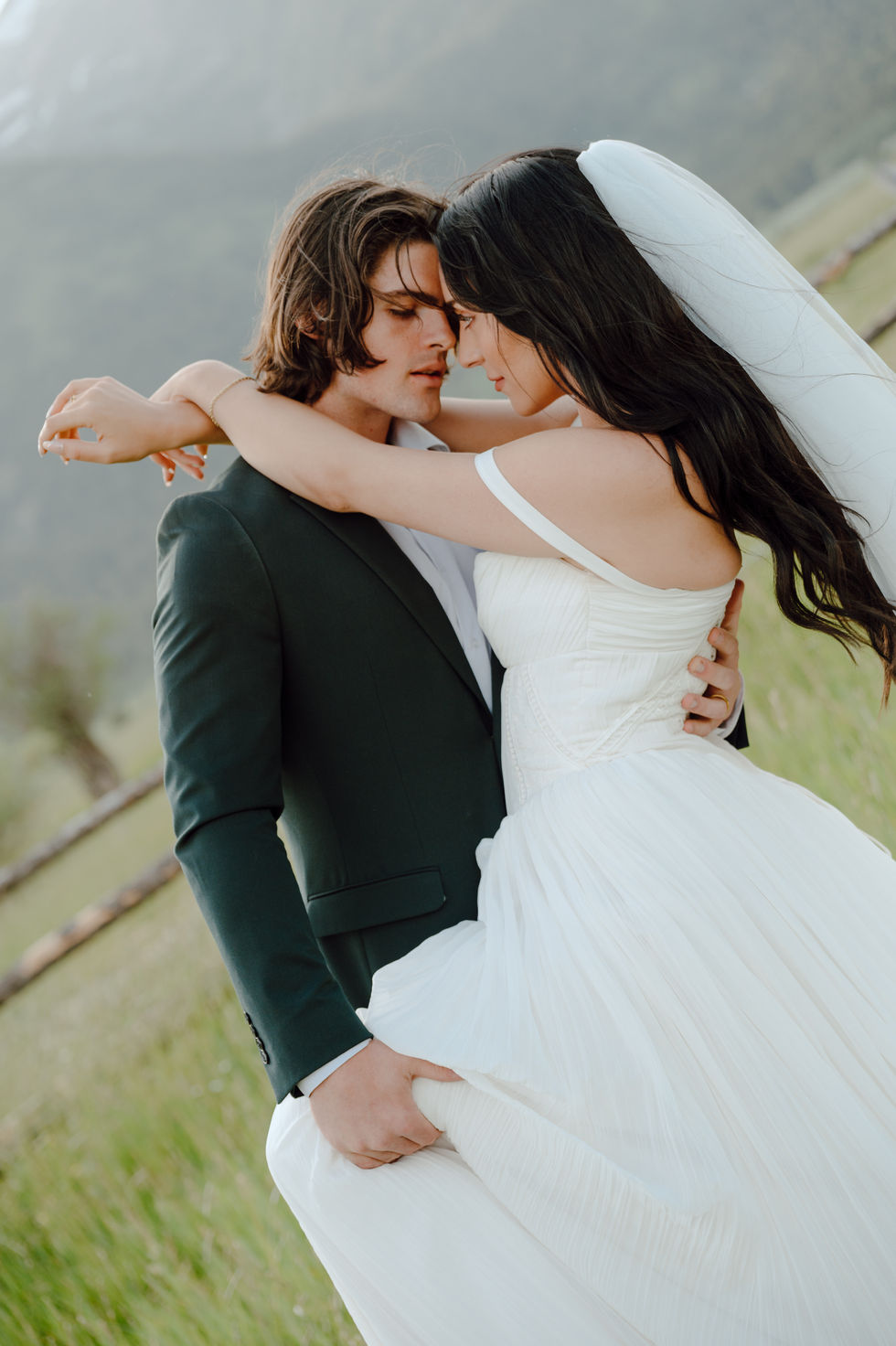 Intimate Bride and Groom couple portraits next to Grand Tetons mountains in Wyoming during adventure elopement