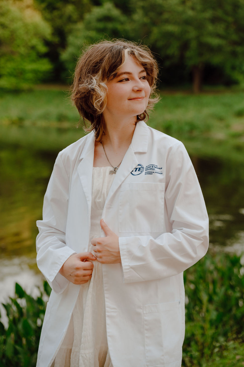 Senior Girl wearing her white jacket from her CTE medical classes at Keller Pointe Dallas Fort Worth, Texas