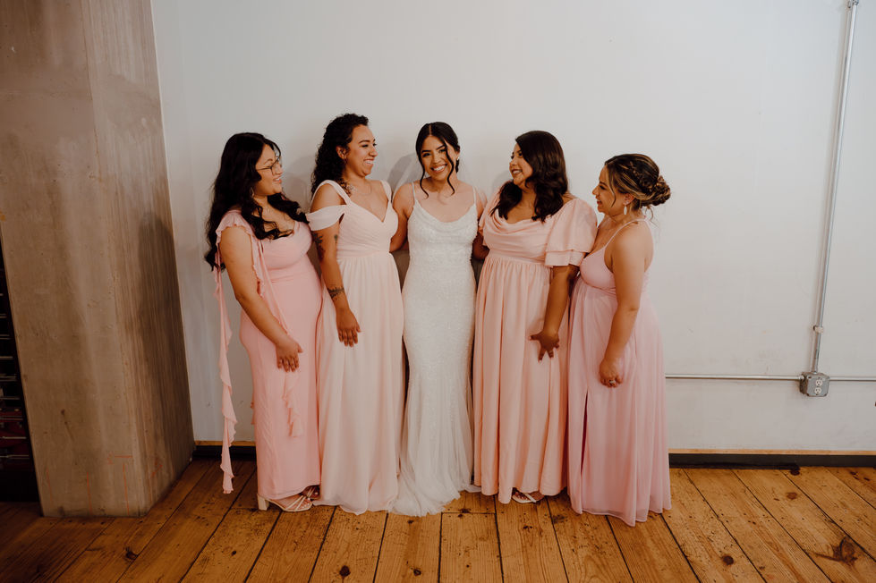 Bridesmaids laughing together before wedding at Inclusion Coffee