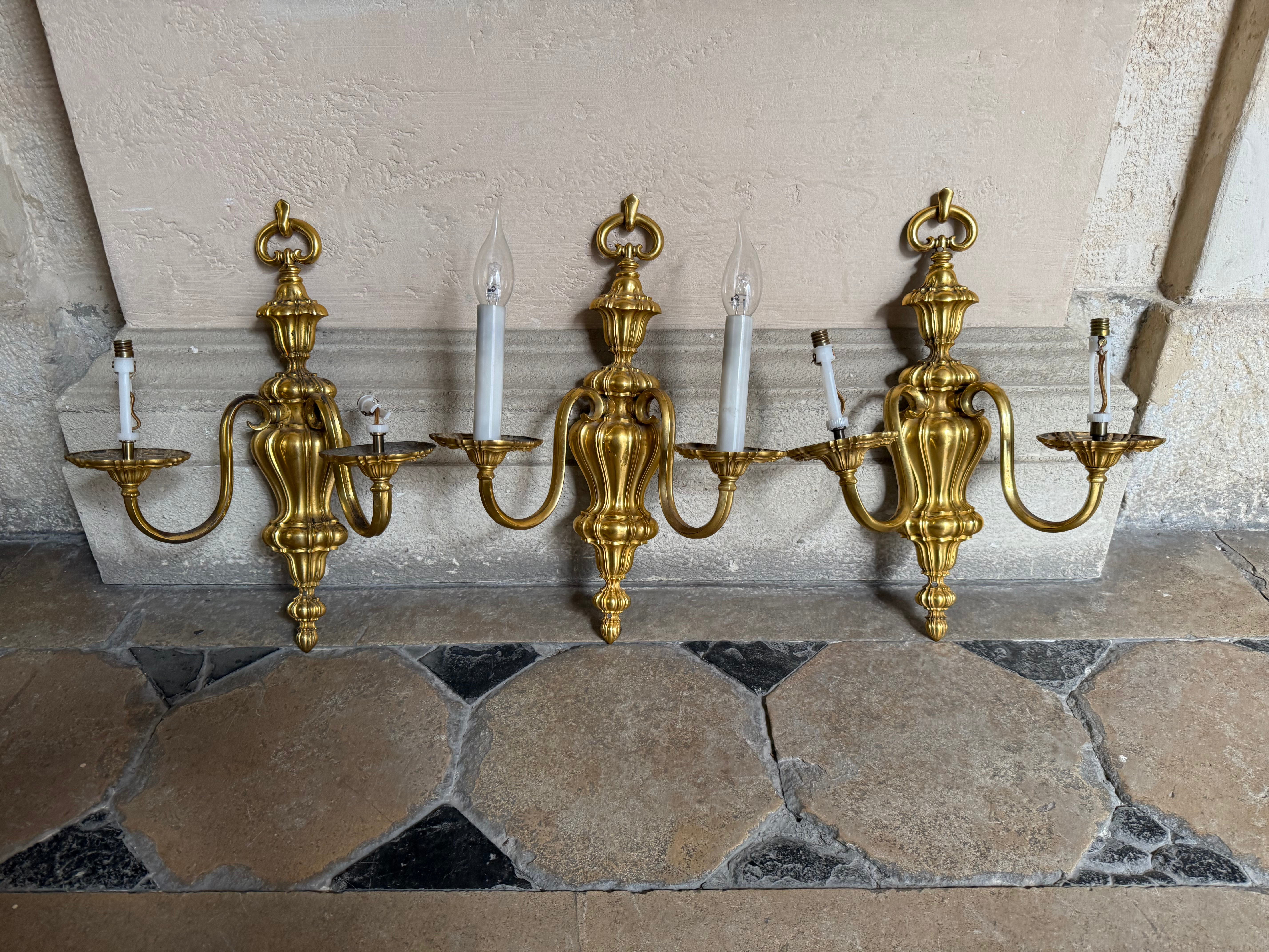 Three gilded bronze sconces
