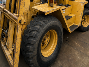 Close-up of a heavy-duty forklift tire and tread