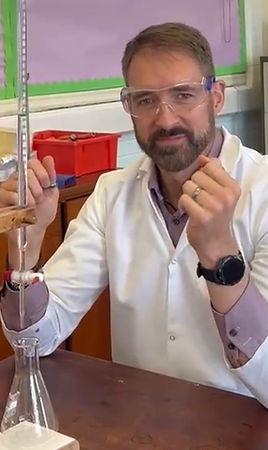 Dave from CrackingChem demonstrating a titration with a burette and conical flask