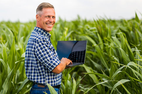 man-with-laptop-looking-camera.jpg