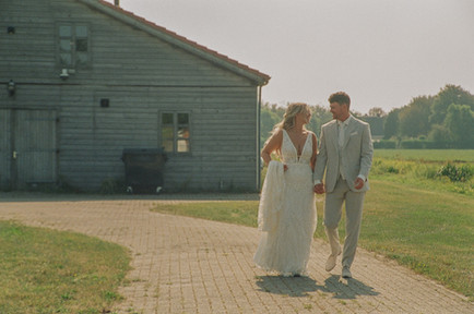 Analog photo of a bride and groom on a farm