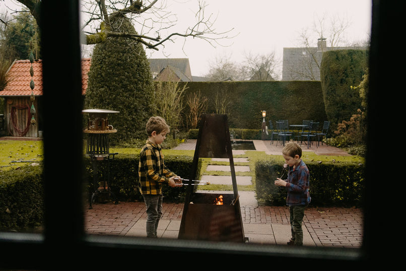 Photo of two boys roasting marshmallows