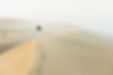 woman-walking-on-top-of-huge-sand-dune-in-morocco-2024-09-17-17-43-23-utc.jpg
