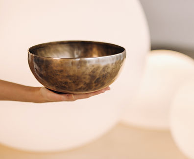 close-up-of-a-tibetan-singing-bowl-in-your-hands-2023-11-27-05-02-33-utc.jpg