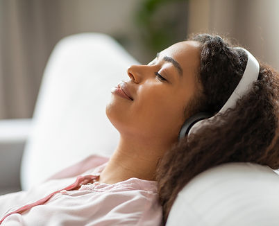 serene-african-american-woman-resting-on-couch-2024-04-22-20-20-53-utc.jpg
