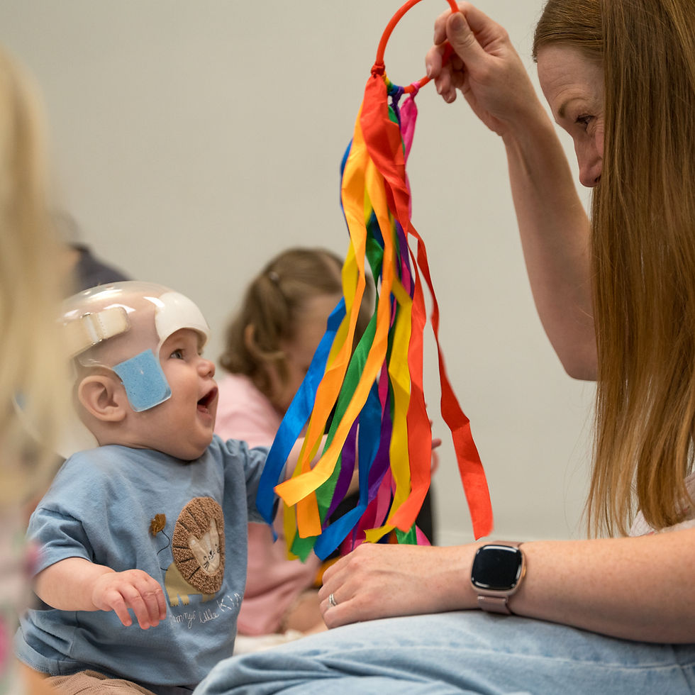 Baby class york information: teacher uses sensory ribbons.