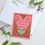 Thumbnail: Greeting card with a praying mantis head in the middle of a heart that says "Valentine, you make me lose my head."