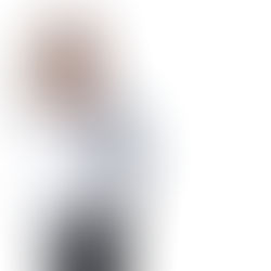 Shea Swinford in a white blazer, a close portrait that stays clear at a small size.