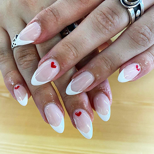 French tips manicure with hearts