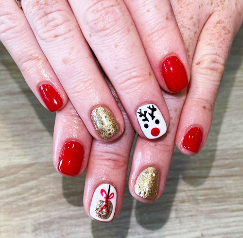 Christmas nails manicure with reindeer face