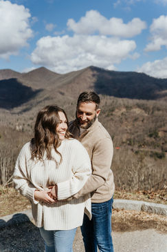 Couple smiling with mountains in background; Engagement Photography Ryan and Whitney