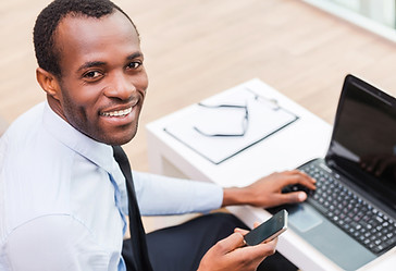Smiling Man on Laptop