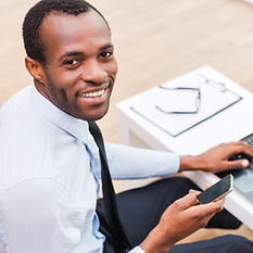Smiling Man on Laptop