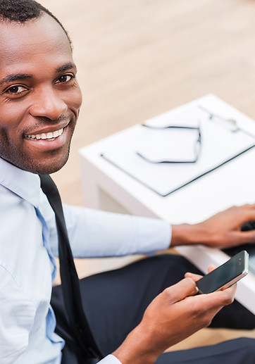 Smiling Man on Laptop