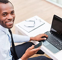 Smiling Man on Laptop
