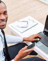 Smiling Man on Laptop