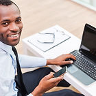 Smiling Man on Laptop