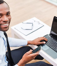Smiling Man on Laptop