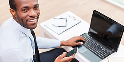 Smiling Man on Laptop