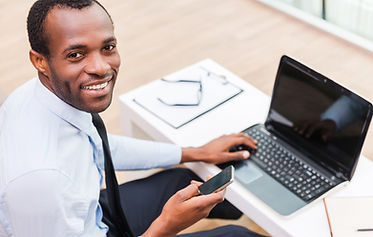 Smiling Man on Laptop