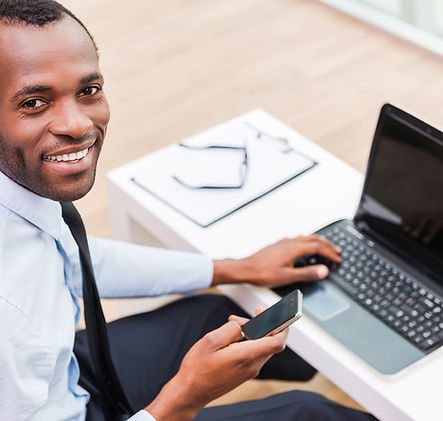 Smiling Man on Laptop