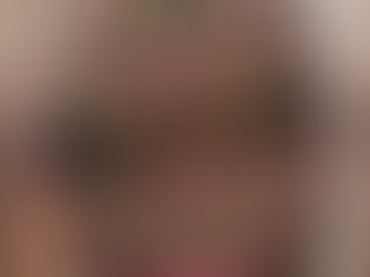 A hand holds a large, round handmade art piece by Ecstatic Art, featuring an intricate dot mandala art design in vibrant pinks, reds, white, and gold on a black canvas. This striking piece is showcased as beautiful mandala wall art and spiritual art for home decor art.