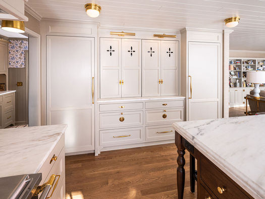 Traditional english cottage kitchen with hand painted cabinets and walnut island