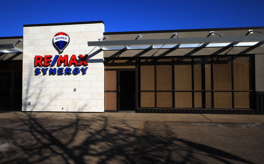 METAL AWNING OVER STOREFRONT SYSTEM