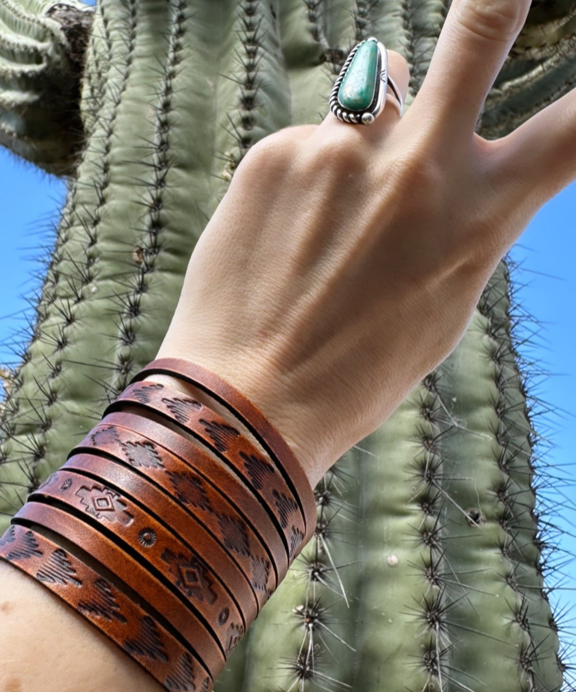 Large handmade leather cuff bracelet. Slit cuff. Hand stamped southwestern design. Dyed a rich tan brown. 