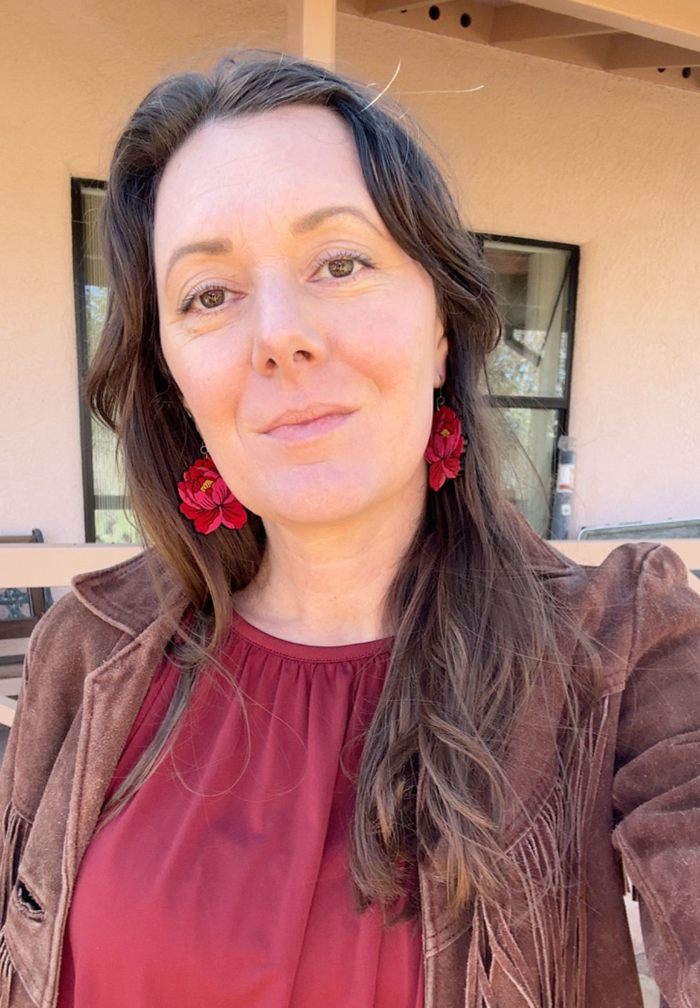 Thumbnail: Model wearing handcrafted bold pink leather peony earrings lightweight hand painted flowers