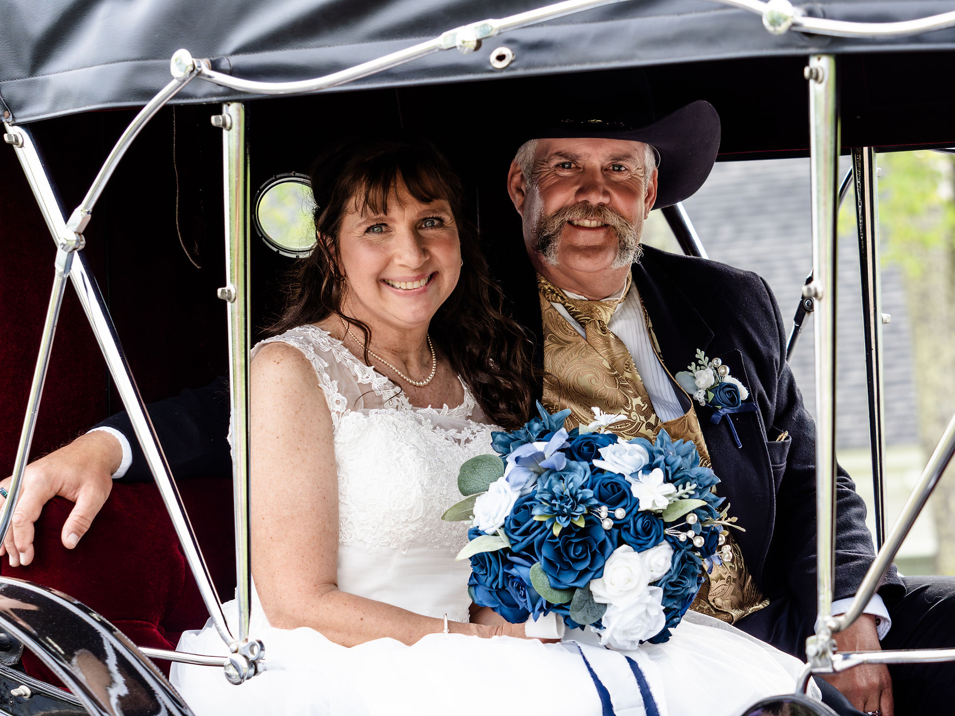 Bride and Groom in Wedding Carriage