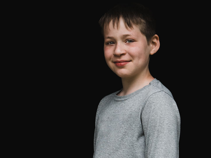 School portrait with black background. Elementary School Student.