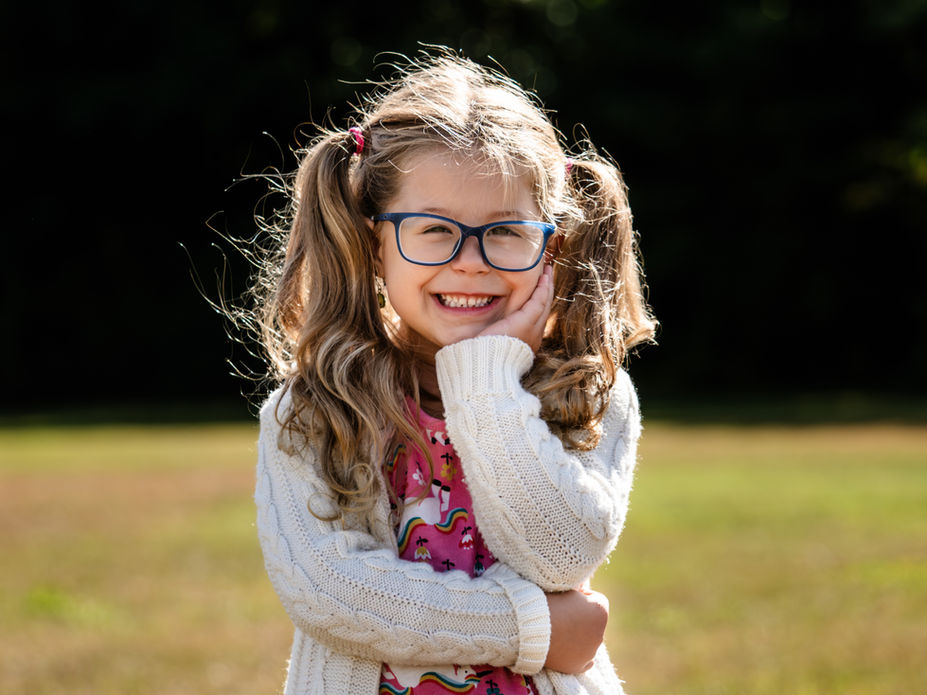 Candid preschool portrait in natural light, New Hampshire school photographer.