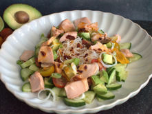 No-cook salmon noodle salad with avocado, cucumber, cherry tomatoes and rice noodles in a chilli-lime dressing.