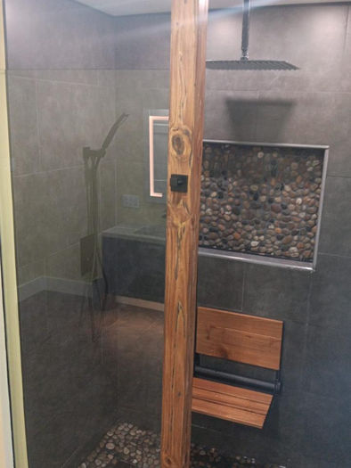 Curbless walk-in shower remodel with pebble tile floor in Eagleville PA