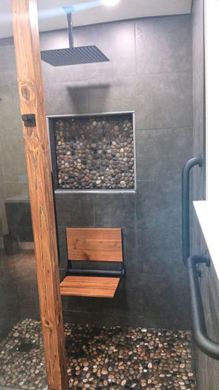 Luxury bathroom remodel with custom walk-in shower and tile flooring in Eagleville PA