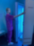 A doctor using phototherapy equipmment