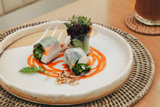Fresh spring rolls with vibrant vegetables and a spicy sauce