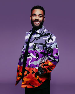 Smiling man in colorful camouflage shirt