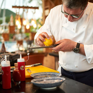 Chef carefully preparing citrus fruit